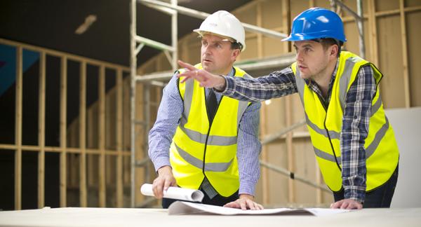 Contractors looking over plans