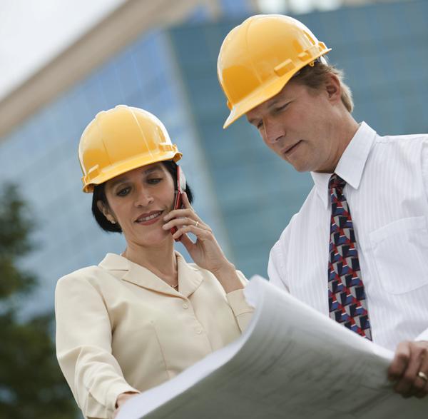 Engineers looking over plans