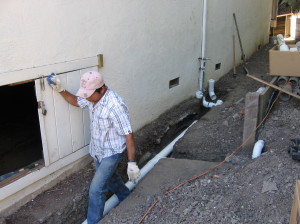 Man installing drainage