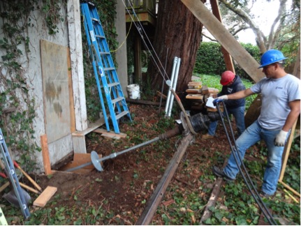 Helical anchor installation to stabilize existing foundation