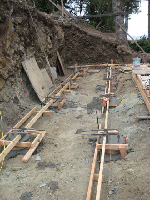 Freshly poured piers with transfer bars sticking out