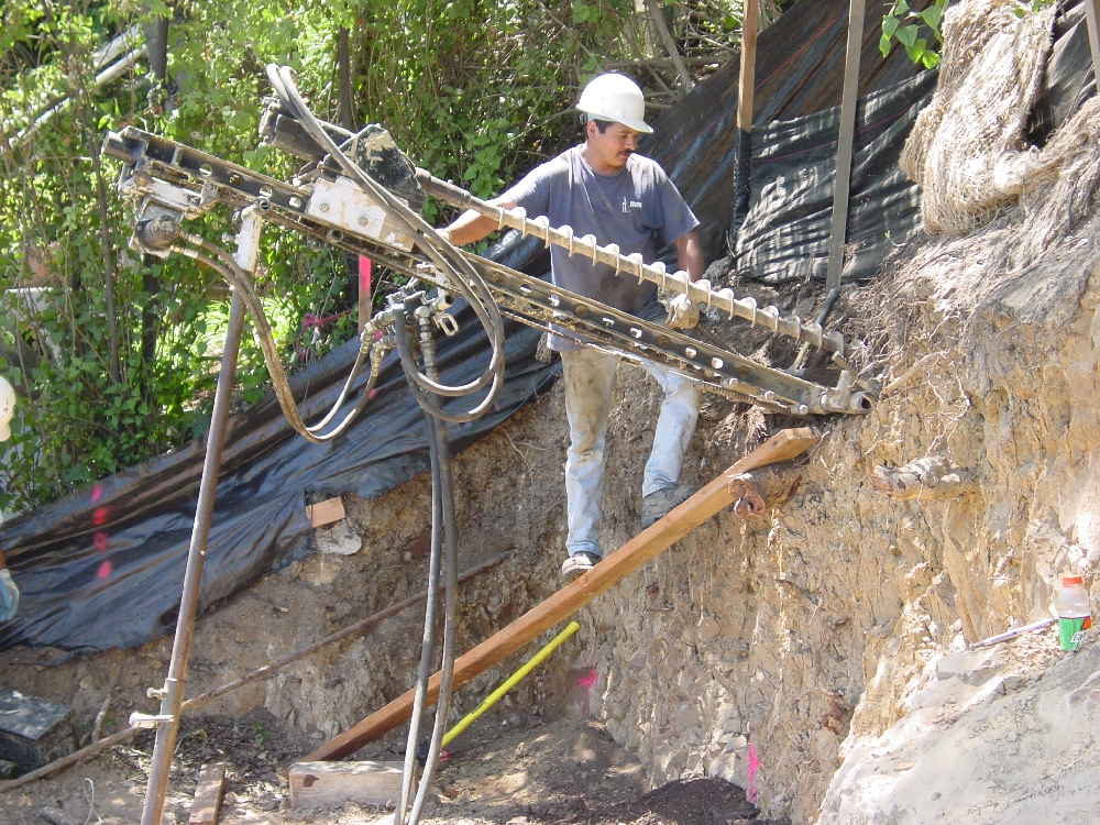 Soil nail drilling on hillside