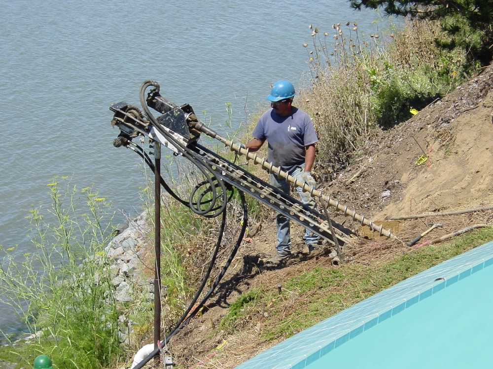 Tieback drilling in remote hillside location