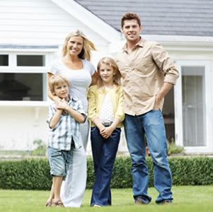 Homeowners - Family in front of home
