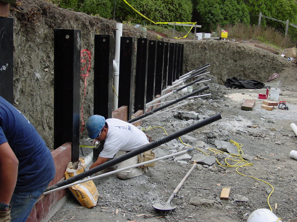 Series of installed tiebacks for soldier beam wall