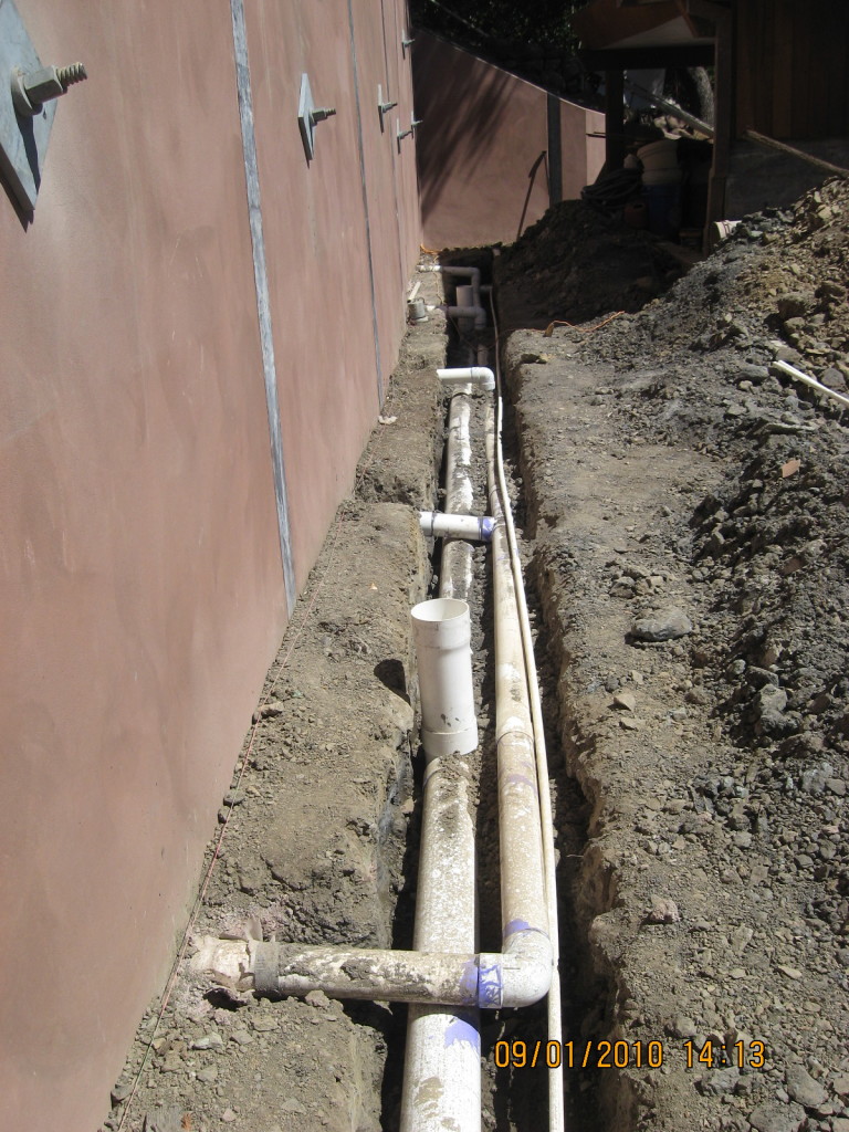 Retaining wall drainage outlet pipes