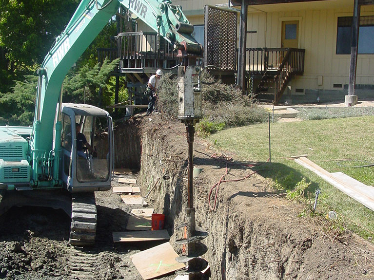 Drilling piers for retaining wall